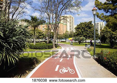 Malaga, Andalusia, Spain; A Trail Through A Park Marked For Pedestrians And Cyclists View Large Photo Image Stock Photo - Malaga, Andalusia, Spain; A Trail Through A Park Marked For Pedestrians And Cyclists. Fotosearch