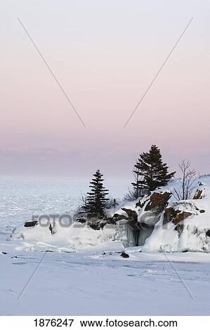 Minnesota, United States Of America; Rock In Ice On The North Shores Of Lake Superior View Large Photo Image Stock Photo - Minnesota, United States Of America; Rock In Ice On The North Shores Of Lake Superior. Fotosearch