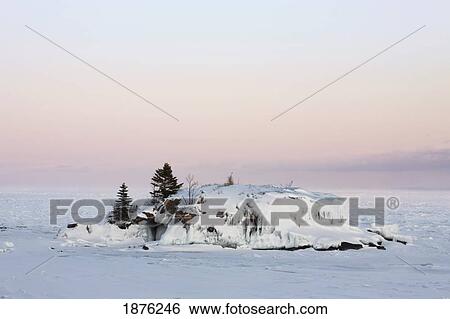 Stock Photograph - Minnesota, United States Of America; Rock In Ice On The North Shores Of Lake Superior. Fotosearch