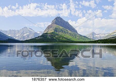 Montana, United States Of America; Swiftcurrent Lake And Grinnell Point In Glacier National Park View Large Photo Image Stock Photo - Montana, United States Of America; Swiftcurrent Lake And Grinnell Point In Glacier National Park. Fotosearch