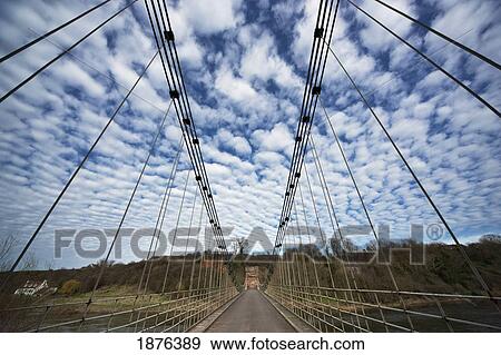 Stock Photo - Northumberland, England; A Bridge With Tall Metal Supports On Either Side. Fotosearch