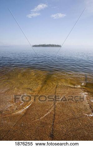 Ontario, Canada; An Island And A Large Rock Slab Under The Water's Surface On Lake Superior View Large Photo Image Stock Photography - Ontario, Canada; An Island And A Large Rock Slab Under The Water's Surface On Lake Superior. Fotosearch