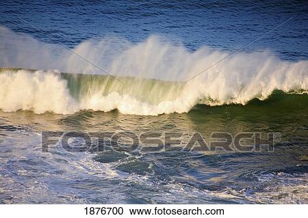 Oregon, United States Of America; A Wave Breaking Near The Shore At Cape Kiwanda View Large Photo Image Stock Image - Oregon, United States Of America; A Wave Breaking Near The Shore At Cape Kiwanda. Fotosearch