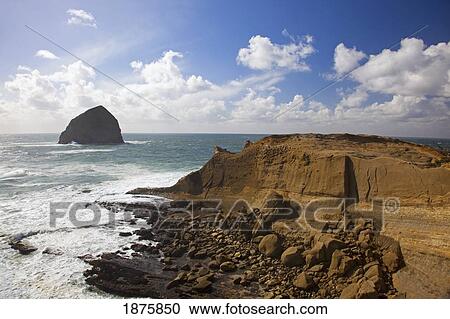 Stock Image - Pacific City, Oregon, United States Of America; Haystack Rock At Cape Kiwanda. Fotosearch