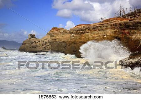 Stock Image - Pacific City, Oregon, United States Of America; Waves Crashing Along The Coast At Cape Kiwanda. Fotosearch