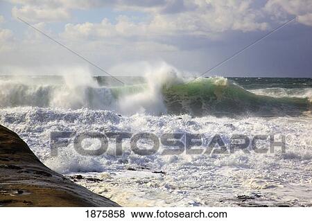 Pacific City, Oregon, United States Of America; Waves Crashing Near The Coast At Cape Kiwanda View Large Photo Image Stock Photo - Pacific City, Oregon, United States Of America; Waves Crashing Near The Coast At Cape Kiwanda. Fotosearch