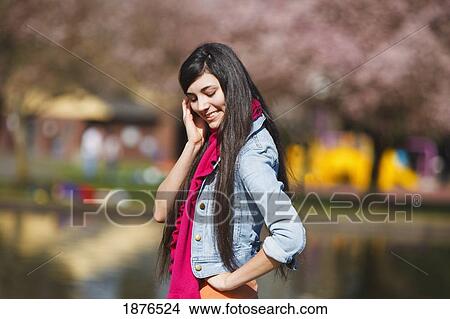 Picture - Portland, Oregon, United States Of America; A Teenage Girl Standing In Portland Park. Fotosearch