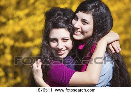 Portland, Oregon, United States Of America; Two Teenage Girls In An Embrace In Portland Park View Large Photo Image Stock Image - Portland, Oregon, United States Of America; Two Teenage Girls In An Embrace In Portland Park. Fotosearch