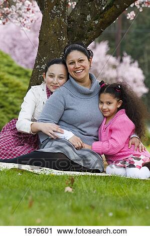 Portland, Oregon, United States Of America; A Mother And Her Two Daughters Under A Cherry Blossom Tree In Spring In Westmorland Park View Large Photo Image Stock Image - Portland, Oregon, United States Of America; A Mother And Her Two Daughters Under A Cherry Blossom Tree In Spring In Westmorland Park. Fotosearch