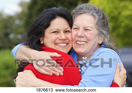 Portland, Oregon, United States Of America; A Mother And Daughter In An Embrace View Large Photo Image Stock Image - Portland, Oregon, United States Of America; A Mother And Daughter In An Embrace. Fotosearch