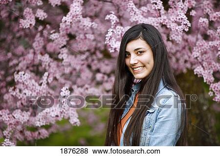 Portland, Oregon, United States Of America; A Teenage Girl By A Tree Full Of Blossoms In Portland Park View Large Photo Image Stock Photo - Portland, Oregon, United States Of America; A Teenage Girl By A Tree Full Of Blossoms In Portland Park. Fotosearch