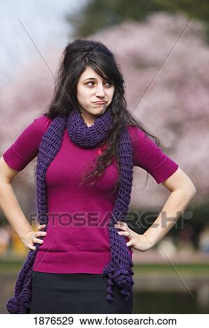 Portland, Oregon, United States Of America; A Teenage Girl Posing With A Pout While Standing In Portland Park View Large Photo Image Stock Photo - Portland, Oregon, United States Of America; A Teenage Girl Posing With A Pout While Standing In Portland Park. Fotosearch