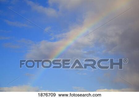 Portland, Oregon, United States Of America; A Rainbow Through The Clouds View Large Photo Image Stock Photo - Portland, Oregon, United States Of America; A Rainbow Through The Clouds. Fotosearch