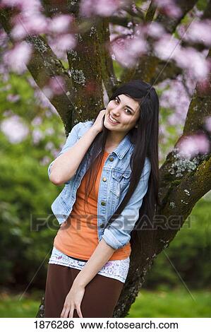 Portland, Oregon, United States Of America; A Teenage Girl Leaning On A Tree In Portland Park View Large Photo Image Stock Photograph - Portland, Oregon, United States Of America; A Teenage Girl Leaning On A Tree In Portland Park. Fotosearch
