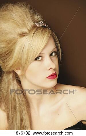 Stock Image - Portrait Of A Glamourous Woman With Blond Hair. Fotosearch