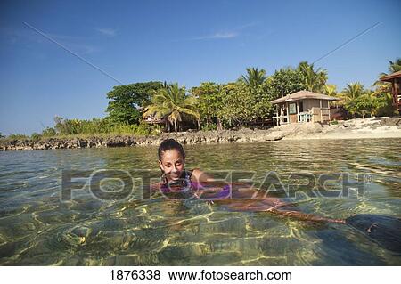 Roatan, Bay Islands, Honduras; A Woman Swimming At Anthony's Key Resort View Large Photo Image Stock Photo - Roatan, Bay Islands, Honduras; A Woman Swimming At Anthony's Key Resort. Fotosearch