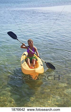 Roatan, Bay Islands, Honduras; A Young Woman Paddling A Kayak At Anthony's Key Resort View Large Photo Image Stock Image - Roatan, Bay Islands, Honduras; A Young Woman Paddling A Kayak At Anthony's Key Resort. Fotosearch