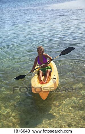 Roatan, Bay Islands, Honduras; A Young Woman Paddling A Kayak At Anthony's Key Resort View Large Photo Image Stock Image - Roatan, Bay Islands, Honduras; A Young Woman Paddling A Kayak At Anthony's Key Resort. Fotosearch
