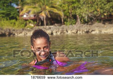 Stock Photo - Roatan, Bay Islands, Honduras; A Young Woman With Snorkeling Gear At Anthony's Key Resort. Fotosearch