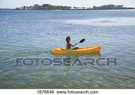 Roatan, Bay Islands, Honduras; A Young Woman Paddling A Kayak At Anthony's Key Resort View Large Photo Image Stock Photograph - Roatan, Bay Islands, Honduras; A Young Woman Paddling A Kayak At Anthony's Key Resort. Fotosearch