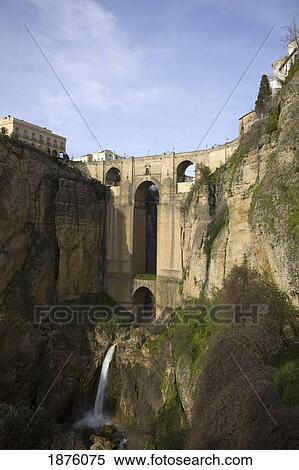 Stock Photography - Ronda, Andalusia, Spain; The Bridge With A Waterfall And Rock Cliffs. Fotosearch