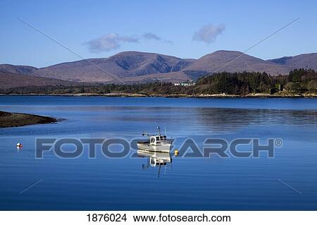 Picture - Rosdohan, County Kerry, Ireland; A Boat In The Water Along The Coast. Fotosearch
