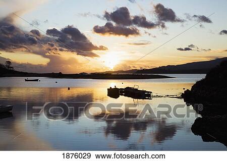 Stock Photo - Rosdohan, County Kerry, Ireland; A Harbor At Sunset Near Sneem. Fotosearch