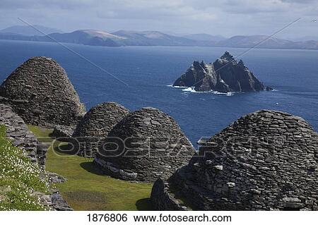 Stock Photograph - Skellig Michael, County Kerry, Ireland; Stone 'beehive' Monk Huts (Clochans) With A View Of Skellig Beag. Fotosearch