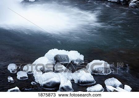 Snow Covered Rocks In The Shallow Water Along A River View Large Photo Image Stock Image - Snow Covered Rocks In The Shallow Water Along A River. Fotosearch