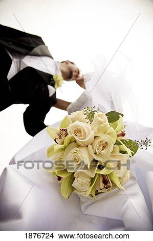 Stoney Creek, Ontario, Canada; A Low Angle View Of A Bride And Groom Kissing View Large Photo Image Picture - Stoney Creek, Ontario, Canada; A Low Angle View Of A Bride And Groom Kissing. Fotosearch