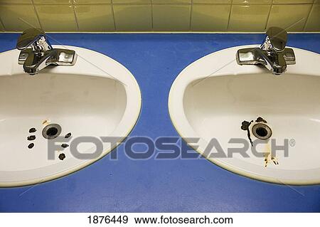 Stock Photo - Stony Plain, Alberta, Canada; Two Sinks With Rust On The Bottom. Fotosearch