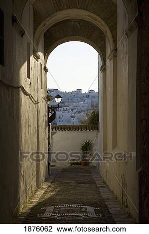 Stock Image - Vejer De La Frontera, Andalusia, Spain; View Of The Town Through A Corridor. Fotosearch