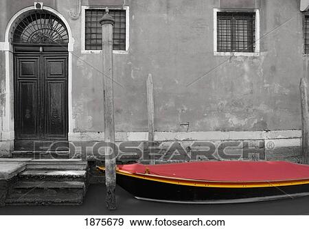 Stock Photo - Venice, Italy; A Small Boat With A Red Cover On A Canal. Fotosearch