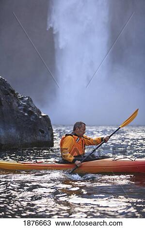 Stock Image - Washington, United States Of America; A Man Kayaking Near Snoqualmie Falls. Fotosearch