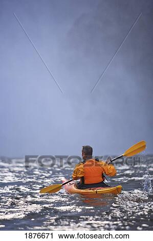 Stock Image - Washington, United States Of America; A Man Kayaking Near Snoqualmie Falls. Fotosearch