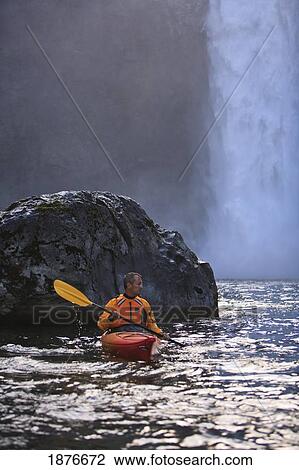 Stock Image - Washington, United States Of America; A Man Kayaking Near Snoqualmie Falls. Fotosearch