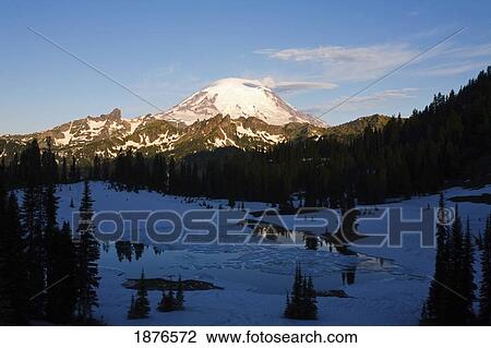 Stock Image - Washington, United States Of America; Sunrise On Mount Rainier And Tipsoo Lake In Mt. Rainier National Park In Winter. Fotosearch