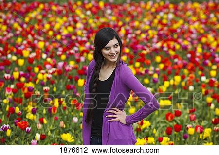 Woodburn, Oregon, United States Of America; A Teenage Girl Poses In Front Of A Tulip Field At Wooden Shoe Tulip Farm View Large Photo Image Stock Image - Woodburn, Oregon, United States Of America; A Teenage Girl Poses In Front Of A Tulip Field At Wooden Shoe Tulip Farm. Fotosearch