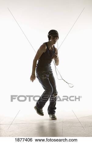 a boy dancing with headphones View Large Photo Image Stock Photograph - a boy dancing with headphones. Fotosearch