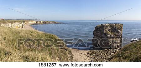 Stock Photo - a crumbling rock structure along the shore; south shields, tyne and wear, england. Fotosearch