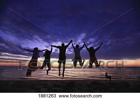 a family jumping on the beach at sunset; belize View Large Photo Image Stock Image - a family jumping on the beach at sunset; belize. Fotosearch