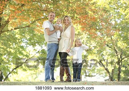 Stock Image - a family portrait in a park; gresham, oregon, united states of america. Fotosearch