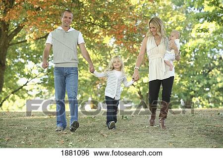 Stock Photograph - a family walking in the park together; gresham, oregon, united states of america. Fotosearch