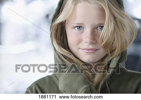 a girl in a green sweater with a hood View Large Photo Image Stock Image - a girl in a green sweater with a hood. Fotosearch
