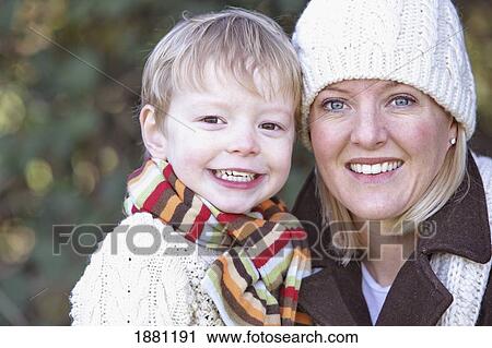 Stock Image - a mother and son wearing scarves and a toque; portland, oregon, united states of america. Fotosearch