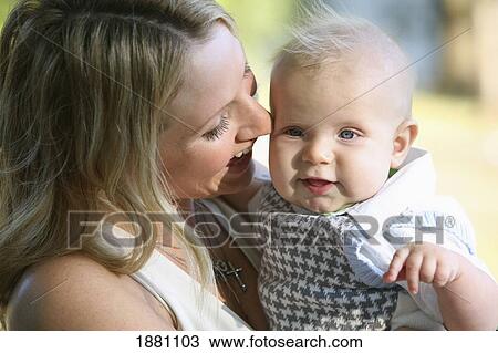 a mother holding her baby boy; gresham, oregon, united states of america View Large Photo Image Stock Image - a mother holding her baby boy; gresham, oregon, united states of america. Fotosearch