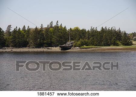 a wrecked boat abandoned on the shore; yarmouth, nova scotia, canada View Large Photo Image Stock Photo - a wrecked boat abandoned on the shore; yarmouth, nova scotia, canada. Fotosearch