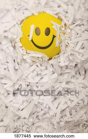 a yellow happy face in paper shreds; edmonton, alberta, canada View Large Photo Image Stock Photography - a yellow happy face in paper shreds; edmonton, alberta, canada. Fotosearch