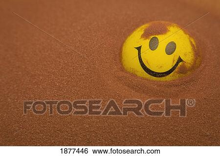 a yellow happy face in the sand; edmonton, alberta, canada View Large Photo Image Stock Photograph - a yellow happy face in the sand; edmonton, alberta, canada. Fotosearch