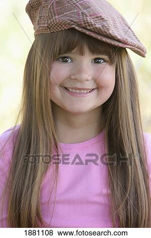 a young girl wearing a hat View Large Photo Image Stock Photo - a young girl wearing a hat. Fotosearch
